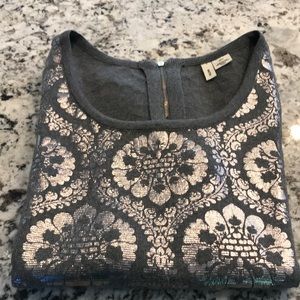 Moth, gray sweater with silver brocade.